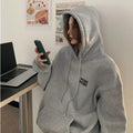 Pink® | Warm, loose-fitting sweater with a hood